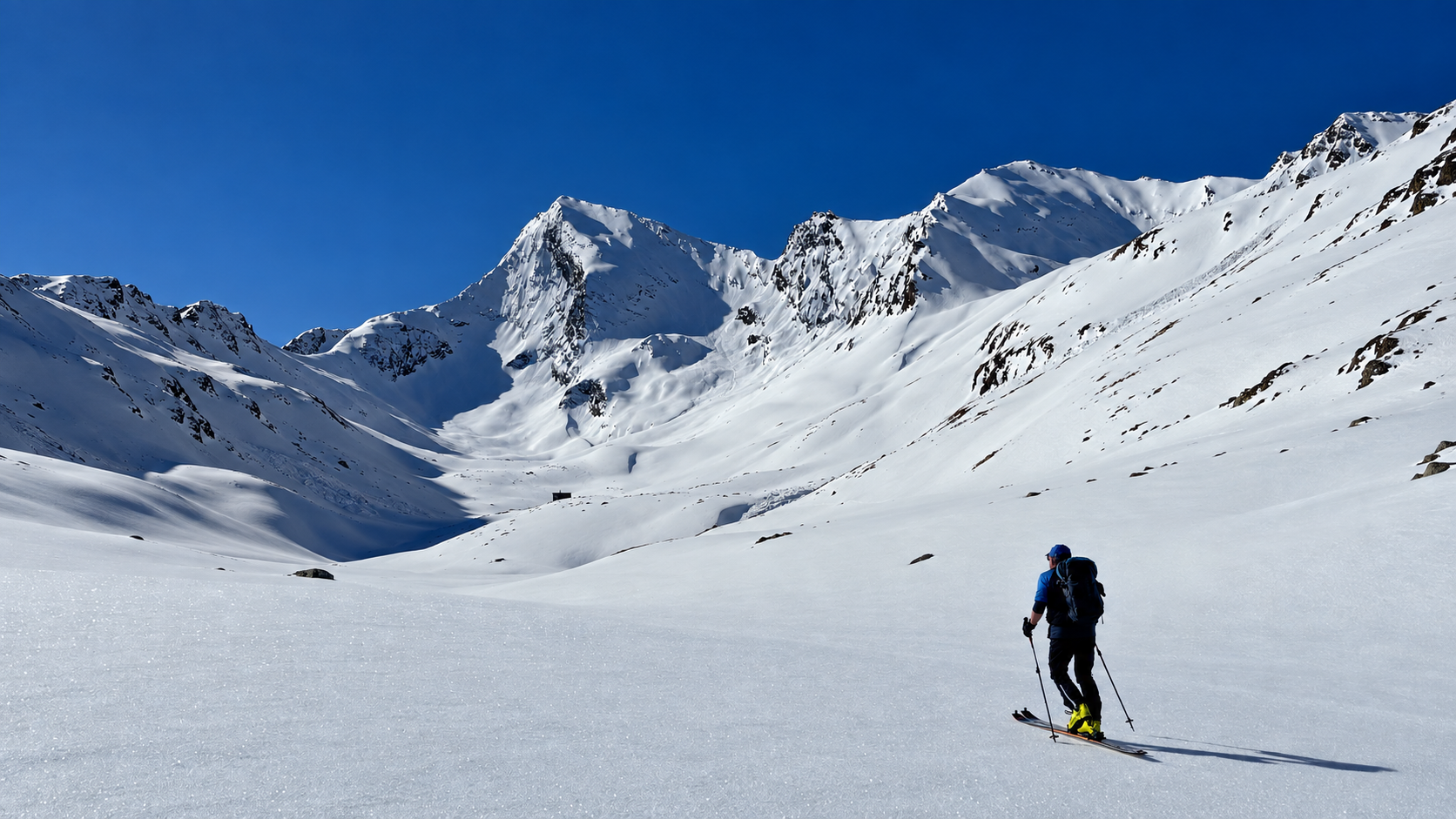 Ski tourer approaching Granatenkogel above the Ferwall Valley near Obergurgl